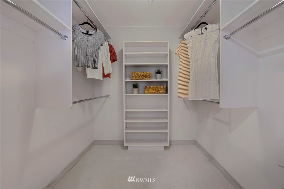 601 West Mercer Place, Unit 201 Seattle, WA 98119 - Photo 21 of 36 a view of walk in closet with clothes and shoes