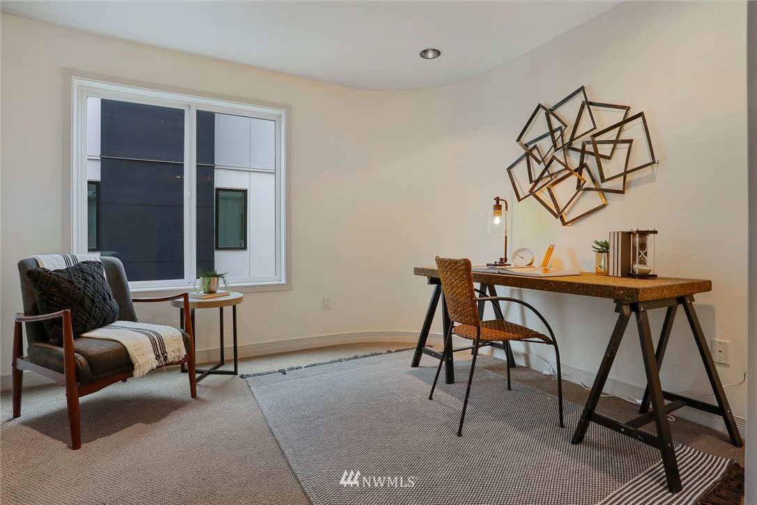 601 West Mercer Place, Unit 201 Seattle, WA 98119 - Photo 24 of 36 a view of a livingroom with furniture and a window