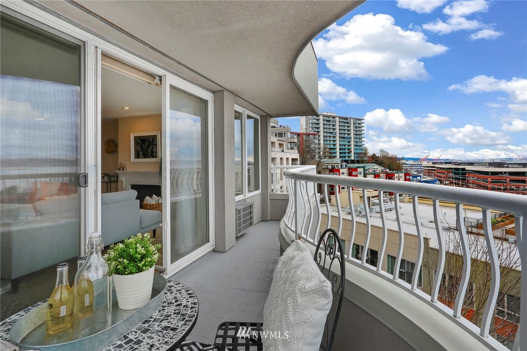601 West Mercer Place, Unit 201 Seattle, WA 98119 - Photo 28 of 36 a view of a balcony with chair and a potted plant