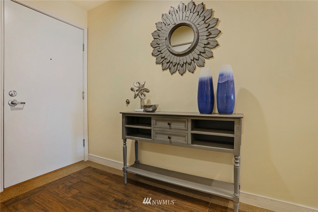 601 West Mercer Place, Unit 201 Seattle, WA 98119 - Photo 3 of 36 a view of a livingroom with furniture and mirror