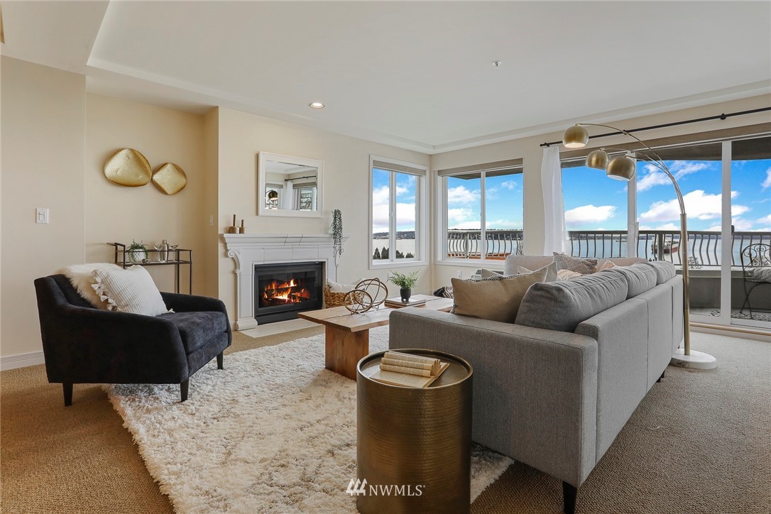 601 West Mercer Place, Unit 201 Seattle, WA 98119 - Photo 4 of 36 a living room with furniture and a fireplace