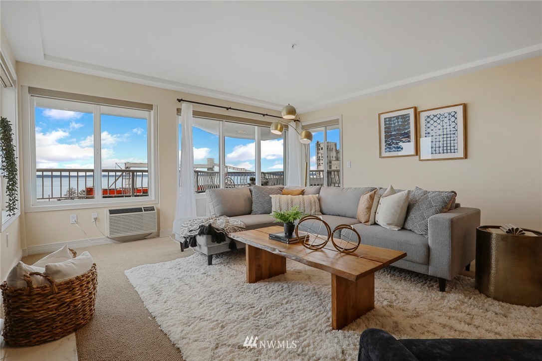 601 West Mercer Place, Unit 201 Seattle, WA 98119 - Photo 5 of 36 a living room with furniture and a floor to ceiling window