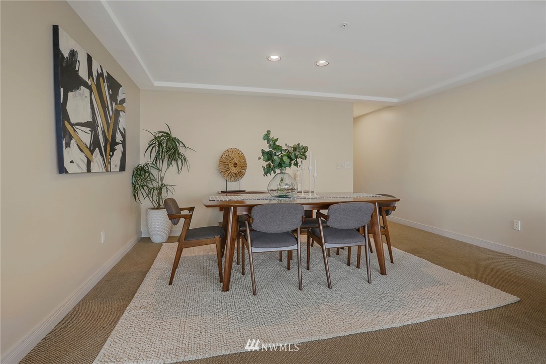 601 West Mercer Place, Unit 201 Seattle, WA 98119 - Photo 8 of 36 a dining room with furniture and window