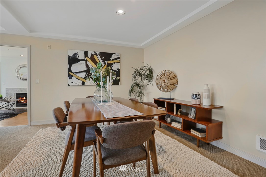 601 West Mercer Place, Unit 201 Seattle, WA 98119 - Photo 9 of 36 a view of a dining room with furniture and wooden floor