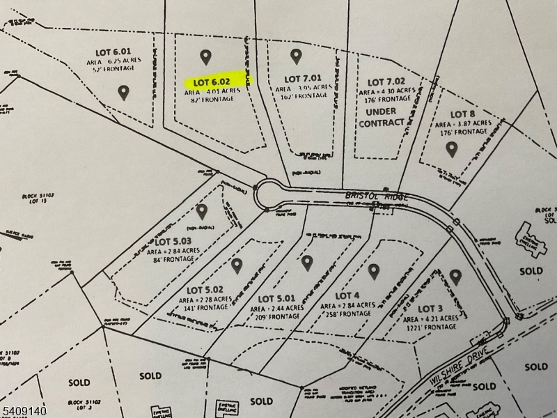 a view of a room with white walls