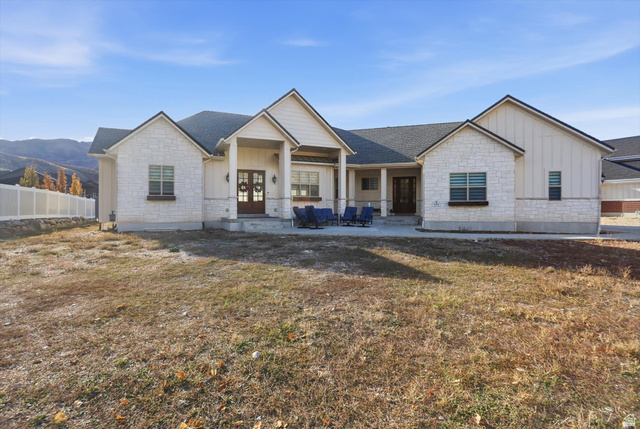 534 East Fish Hatchery Road Mantua, UT 84324 - Photo 61 of 87 View of front of house with board and batten siding, stone siding, covered porch, french doors, and a mountain view