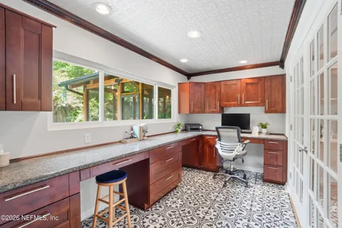 a kitchen with a sink stove and cabinets