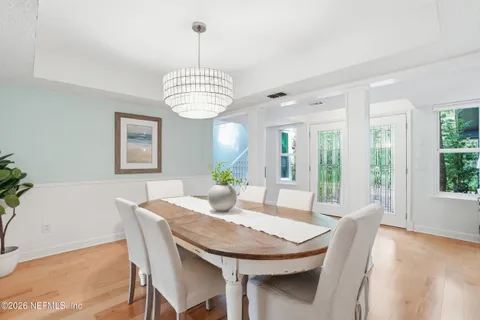 a view of a dining room with furniture window and wooden floor