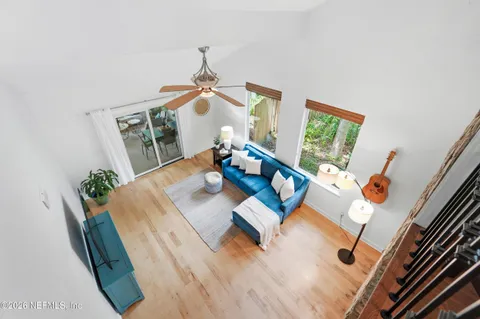 a view of living room with furniture and a chandelier