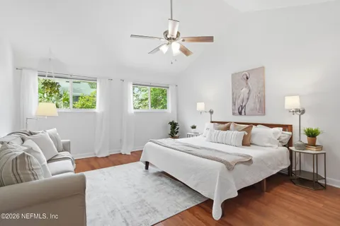 a bedroom with a bed and window