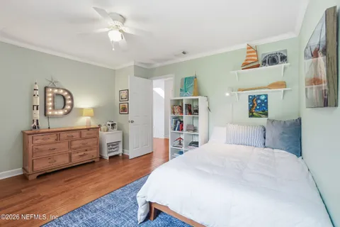 a bedroom with a bed and furniture