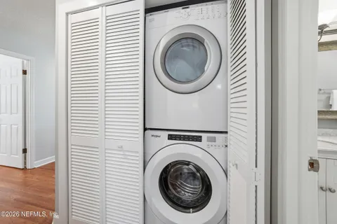 a view of a hallway with washer and dryer