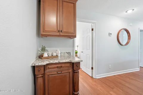 a view of cabinets with wooden floor