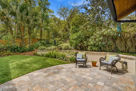 a view of backyard with sitting area