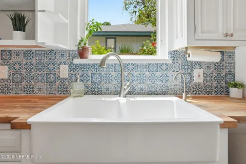 a bathroom with a bathtub and sink