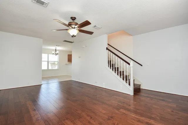 a view of an entryway with wooden floor