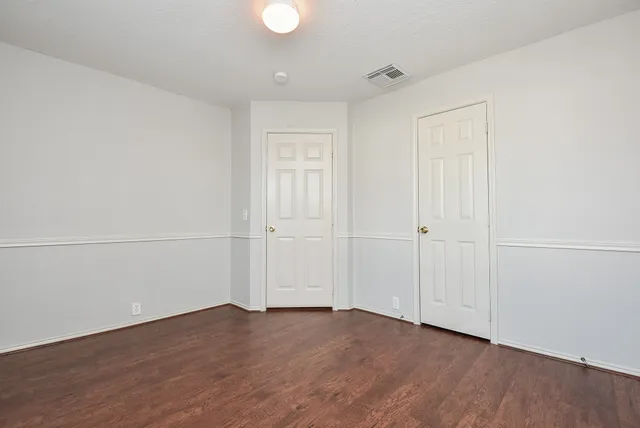 a view of a livingroom with wooden floor