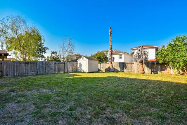 a view of a garden with a house