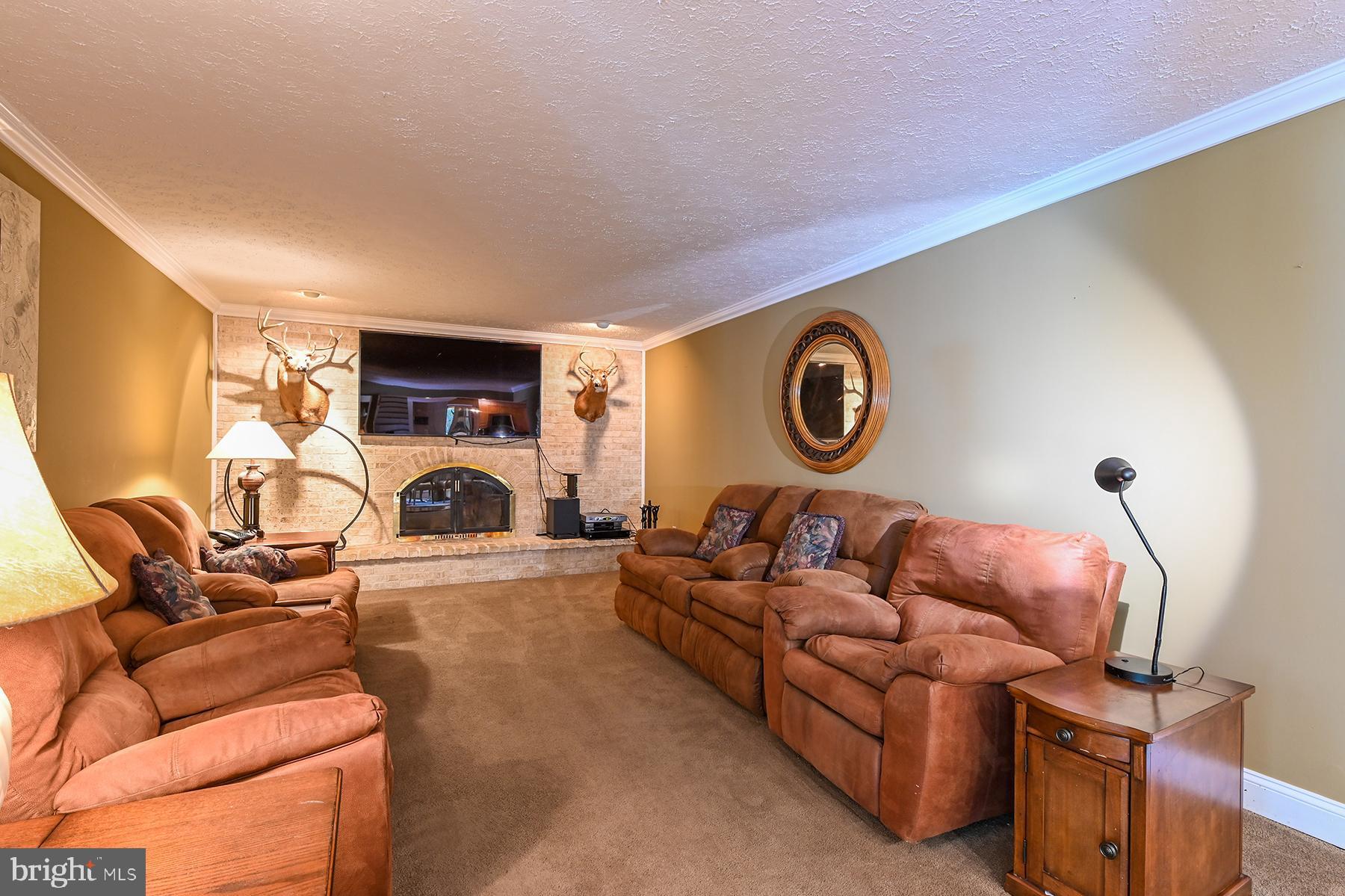 342 Hunner Road Pasadena, MD 21122 - Photo 32 of 67 Family room with fireplace and big screen TV