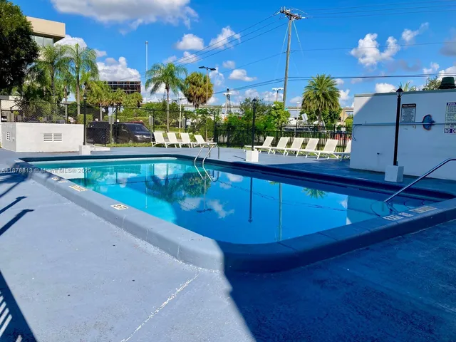 a view of a swimming pool with a patio