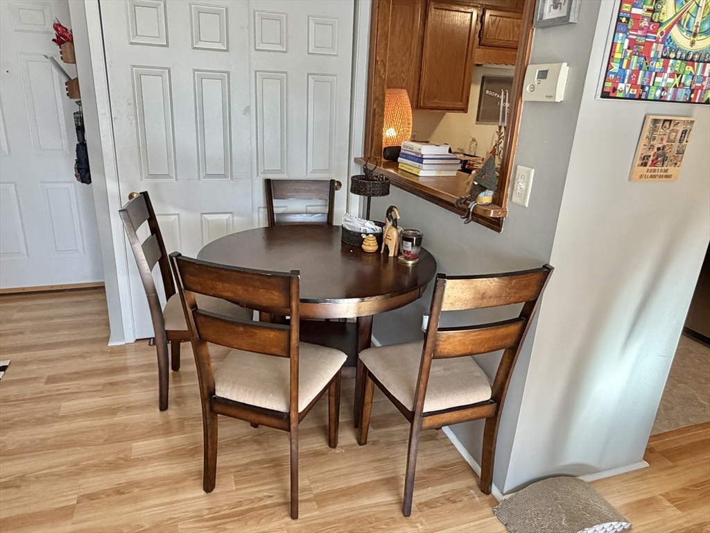 136 Central Street, Unit C 6 Hudson, MA 01749 - Photo 12 of 20 a dining room with furniture and wooden floor