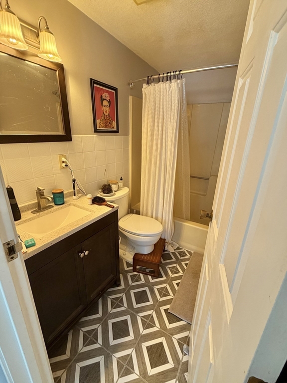 136 Central Street, Unit C 6 Hudson, MA 01749 - Photo 19 of 20 a bathroom with a sink and a mirror