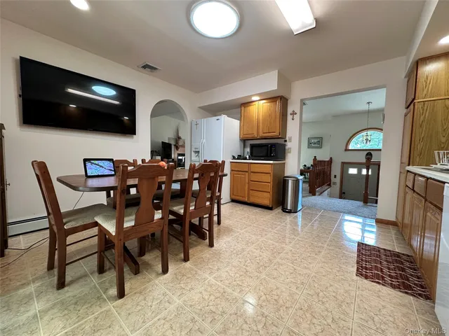 a view of a livingroom with furniture and a flat screen tv