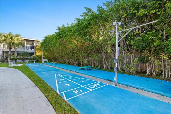 a swimming pool with outdoor seating and yard