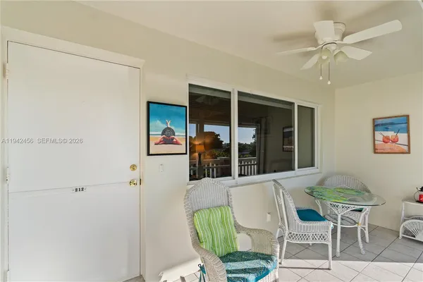 a view of a balcony with furniture