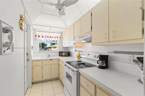 a view of a kitchen with appliances and cabinets