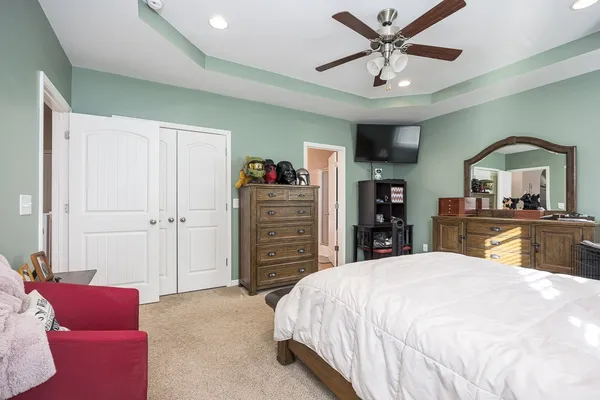 a bed room with a bed and a television