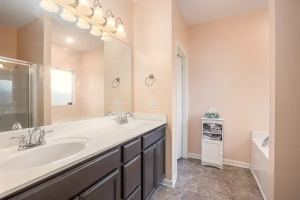 a bathroom with a sink a vanity and a mirror
