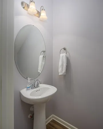 a bathroom with a sink and mirror