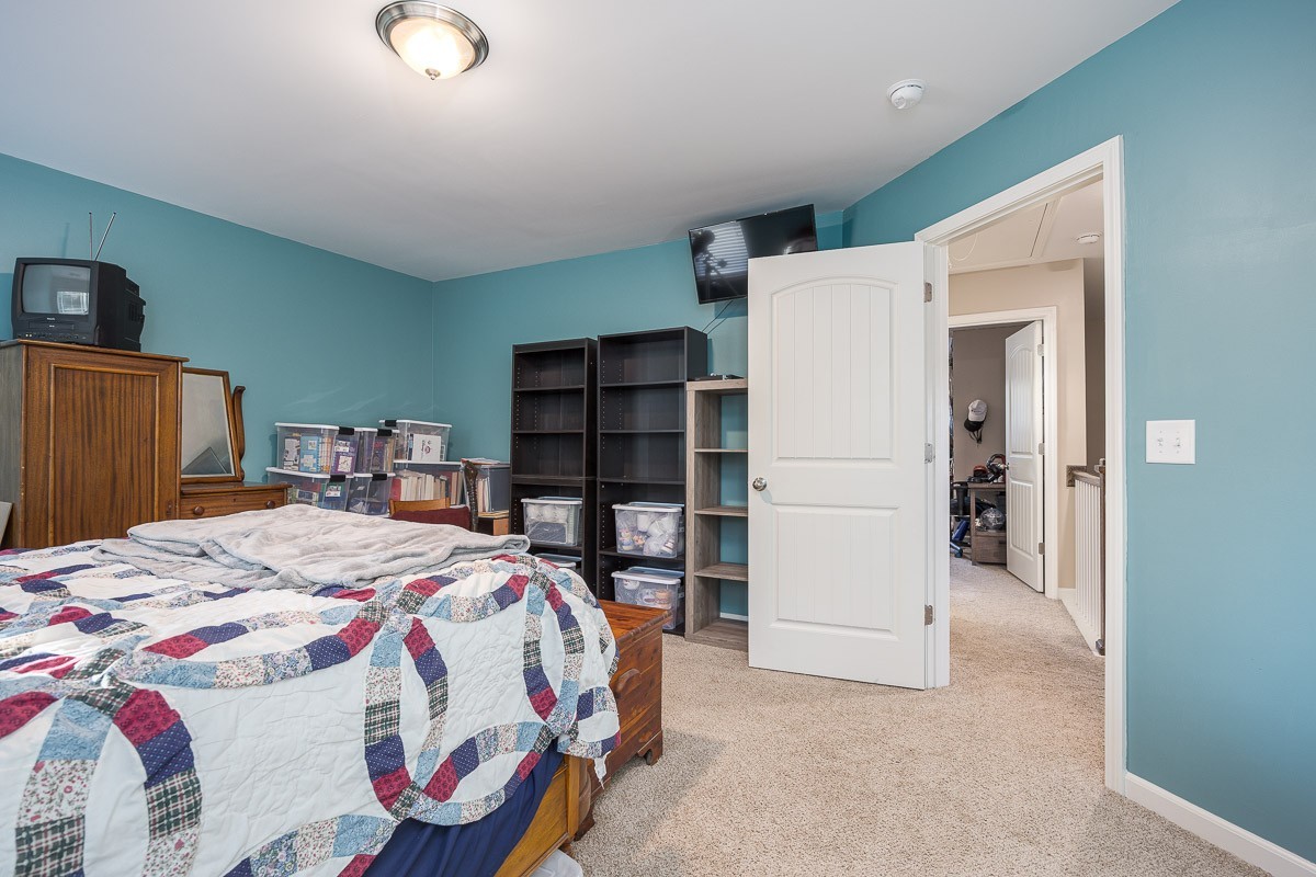 2003 Case Way Fairview, TN 37062 - Photo 19 of 28 a bed sitting in a bedroom and kitchen view