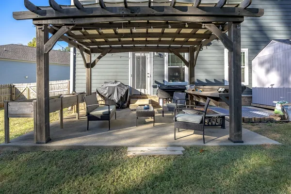 a view of a backyard with sitting area