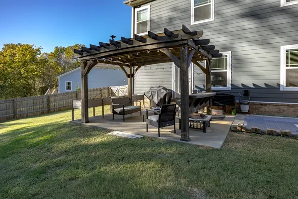 a view of a chairs and table in the patio