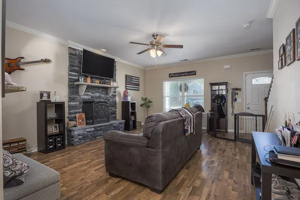 a living room with furniture and a flat screen tv
