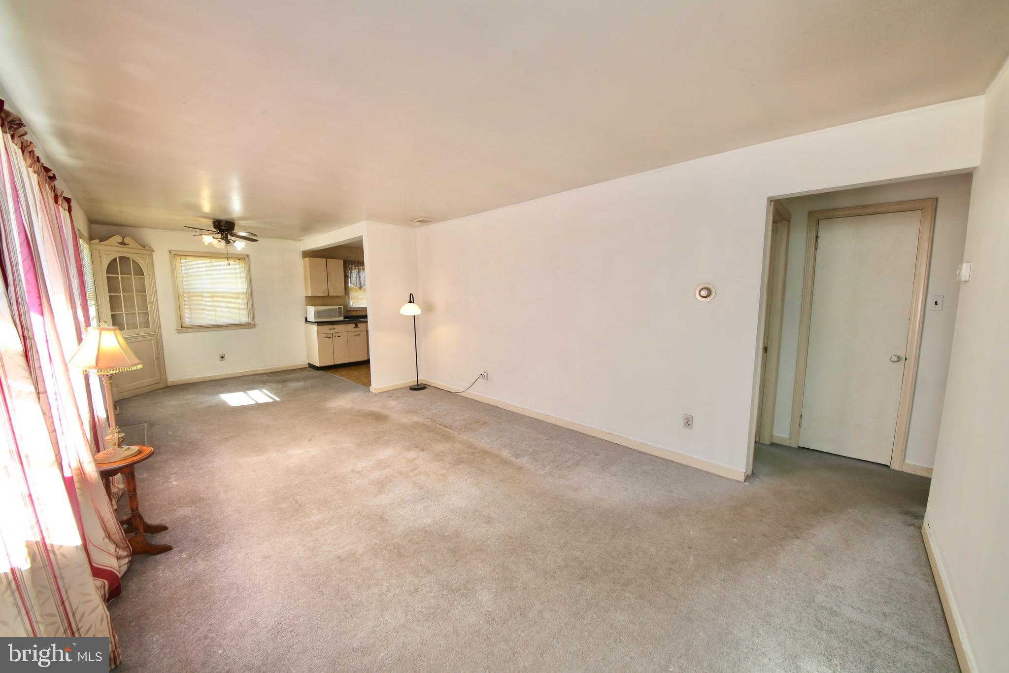 7 Warwick Road Stratford, NJ 08084 - Photo 4 of 25 a view of a livingroom with a staircase
