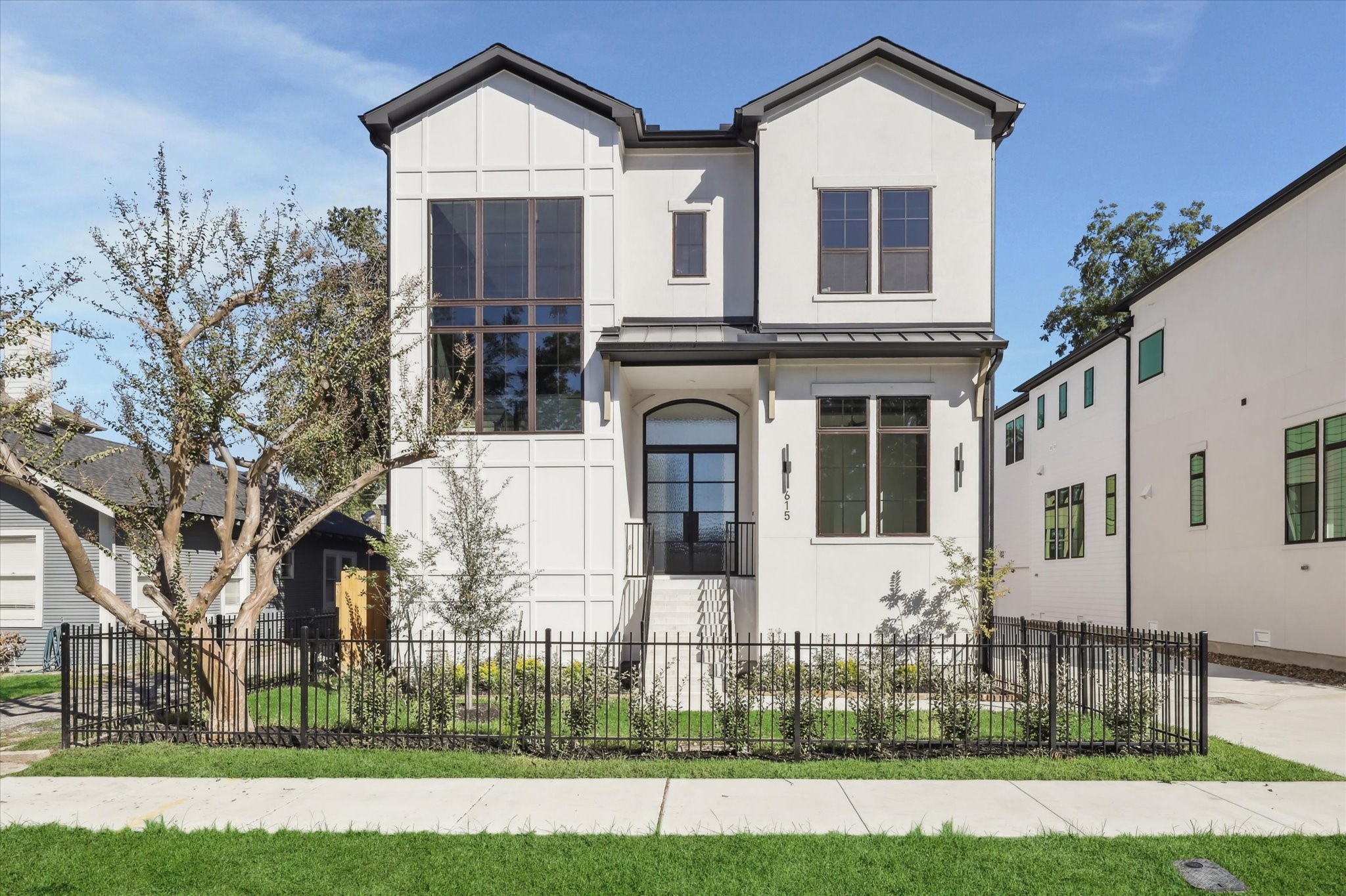 front view of a house with a yard