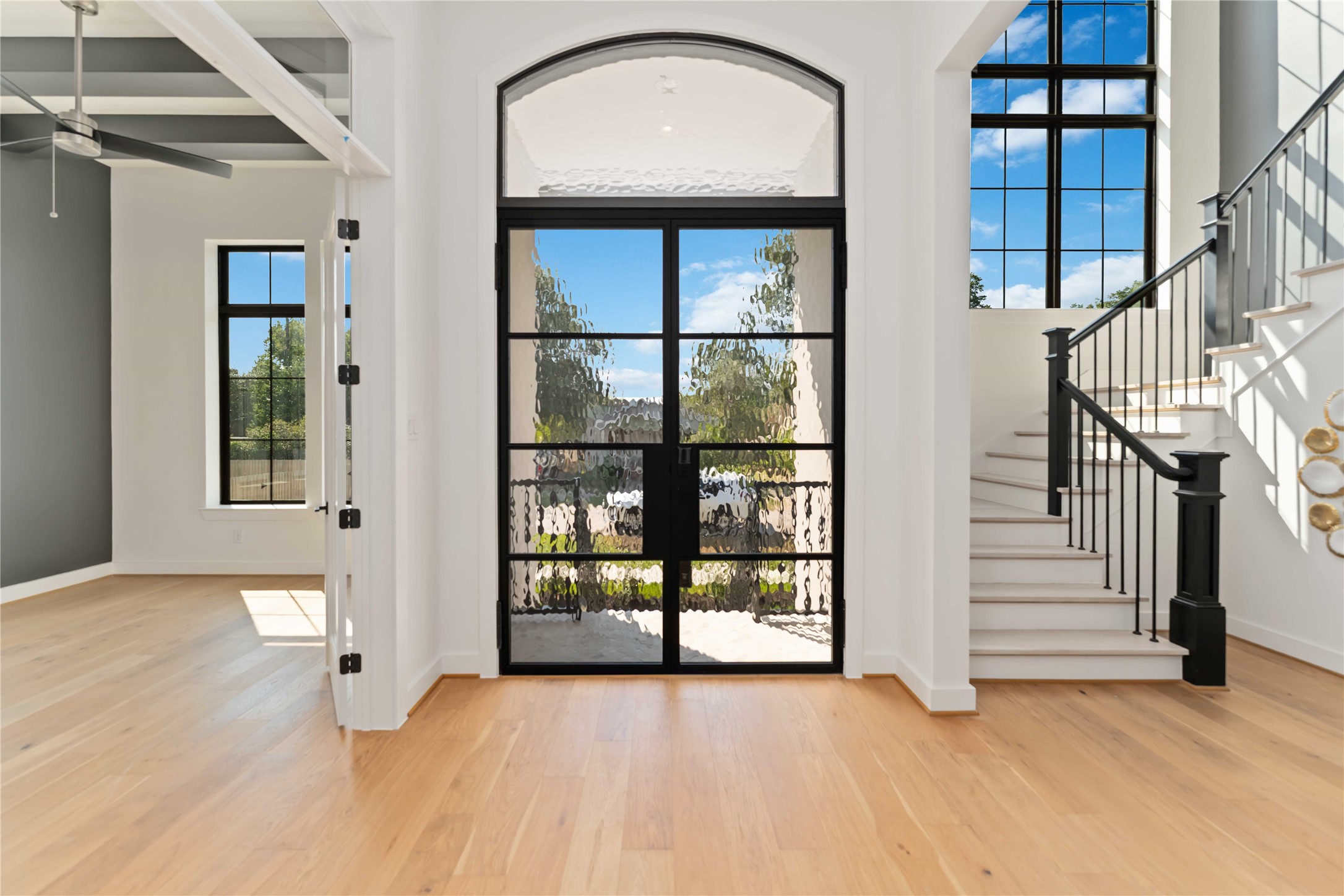 615 Wendel Street Houston, TX 77009 - Photo 3 of 21 an empty room with wooden floor and windows