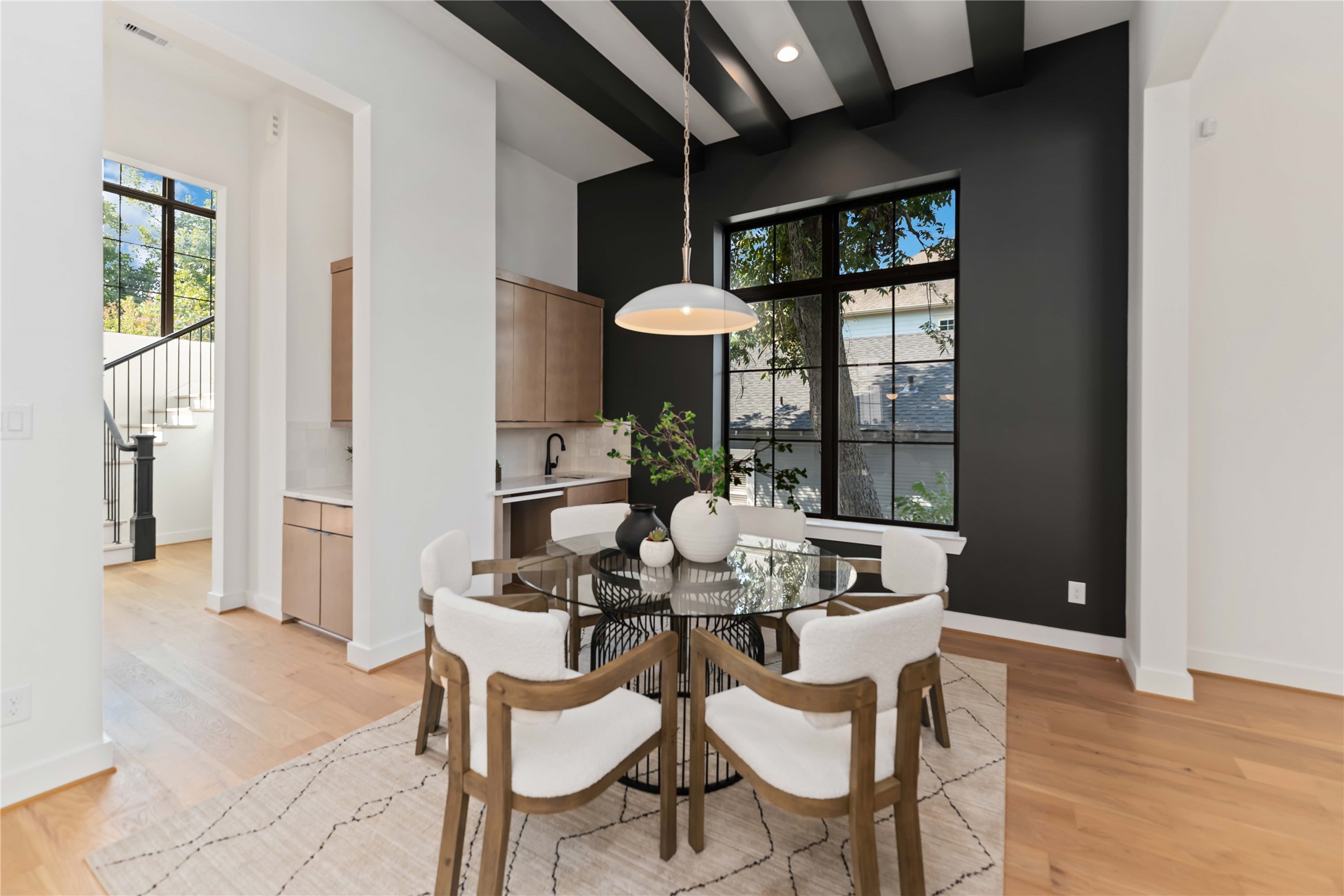 615 Wendel Street Houston, TX 77009 - Photo 6 of 21 a dining room with furniture a chandelier and wooden floor