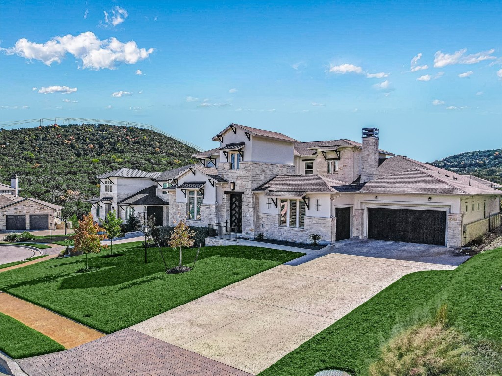a front view of house with yard and green space