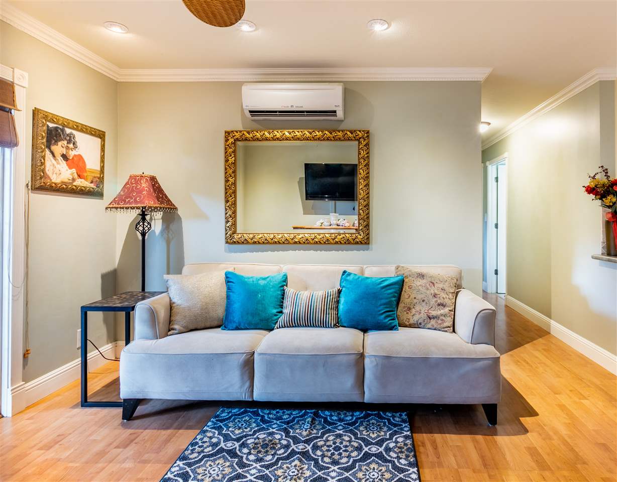 140 Uwapo Road, Unit 6101 Kihei, HI 96753 - Photo 2 of 30 a living room with furniture and a rug