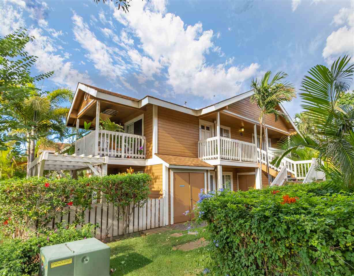140 Uwapo Road, Unit 6101 Kihei, HI 96753 - Photo 30 of 30 a front view of a house with a yard and potted plants