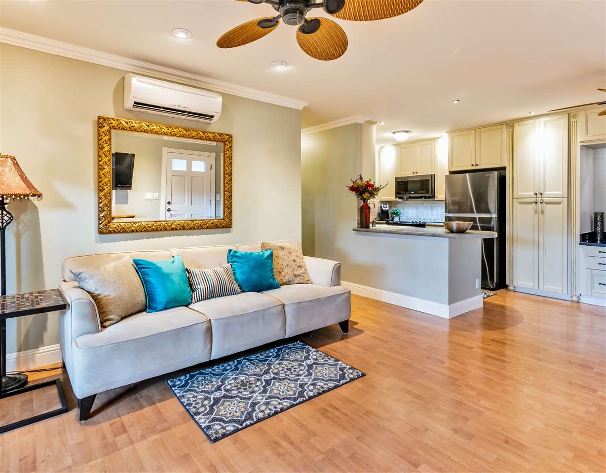 140 Uwapo Road, Unit 6101 Kihei, HI 96753 - Photo 3 of 30 a living room with furniture and kitchen view
