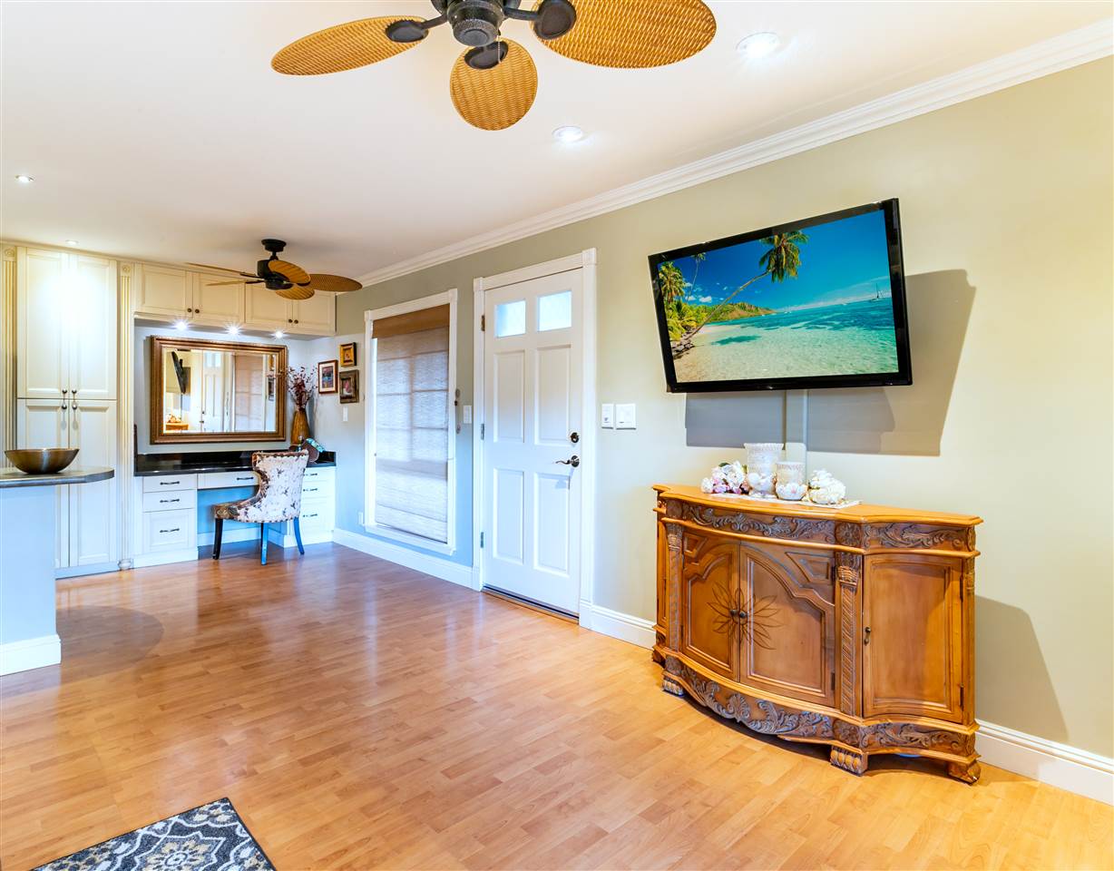140 Uwapo Road, Unit 6101 Kihei, HI 96753 - Photo 4 of 30 a living room with furniture and a flat screen tv