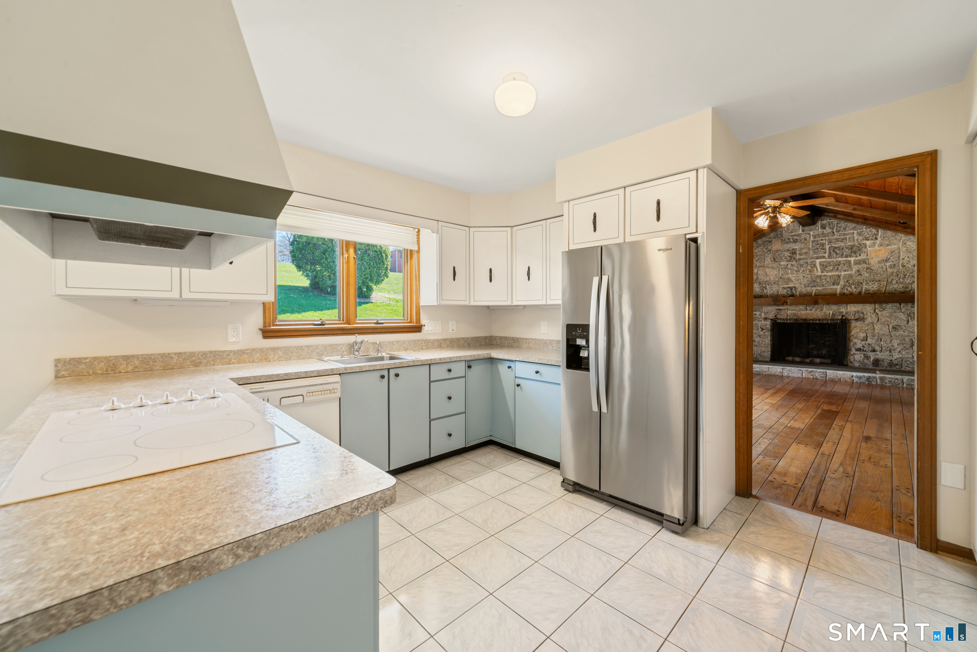 131 Sentinel Hill Road Derby, CT 06418 - Photo 8 of 40 a kitchen with a sink a refrigerator and a stove top oven