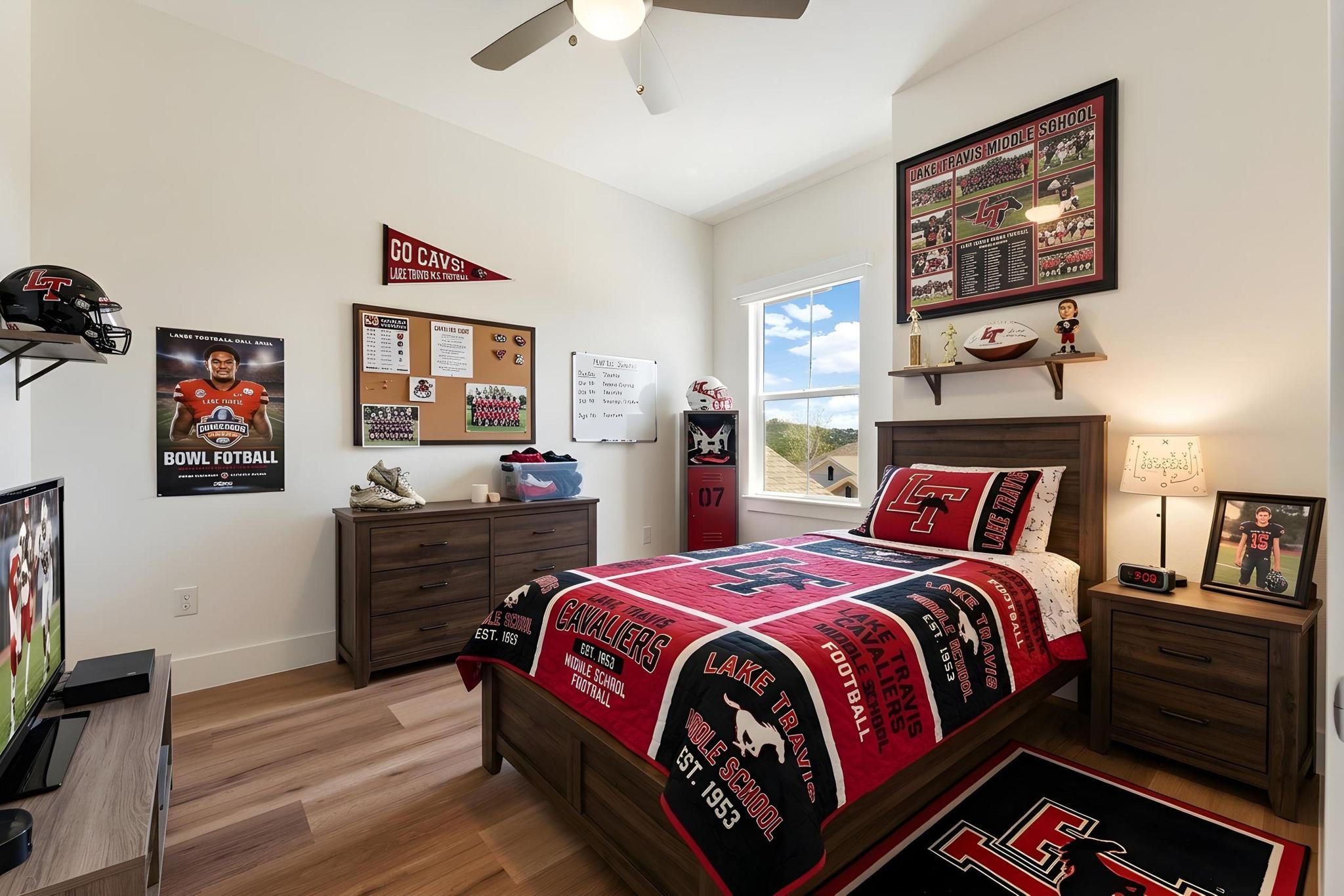 306 Cartwheel Bend, Unit 130 Austin, TX 78738 - Photo 13 of 40 a bedroom with a bed and a flat screen tv