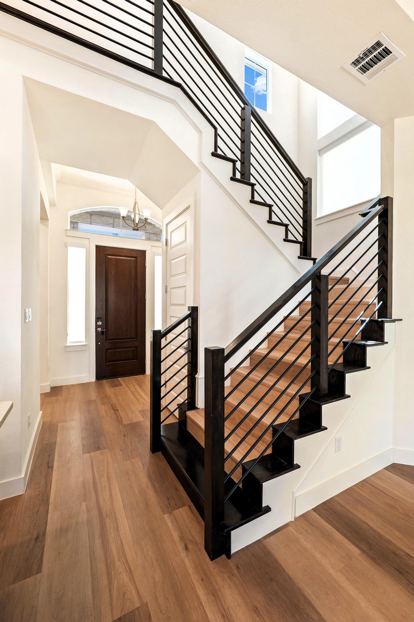306 Cartwheel Bend, Unit 130 Austin, TX 78738 - Photo 19 of 40 a view of entryway and hall with wooden floor