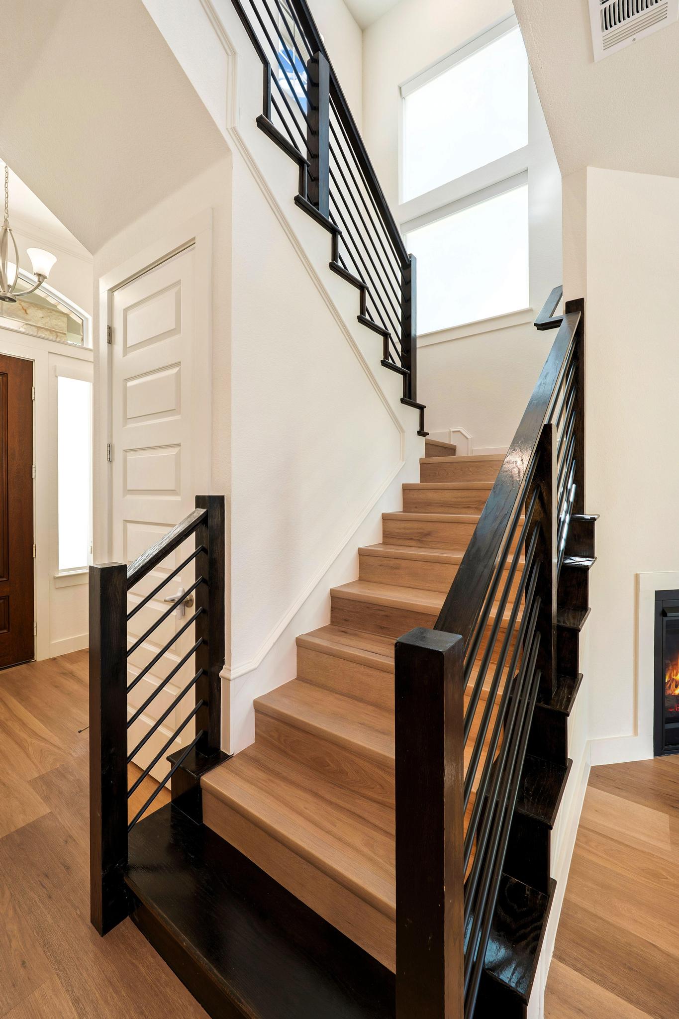 306 Cartwheel Bend, Unit 130 Austin, TX 78738 - Photo 20 of 40 a view of entryway and hall with wooden floor
